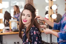 female-hairdresser-standing-making-hairstyle-600nw-391326496 (1)