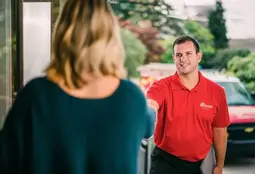 mrh-deck-repair-technician-being-greeted-by-client-at-front-door (1)